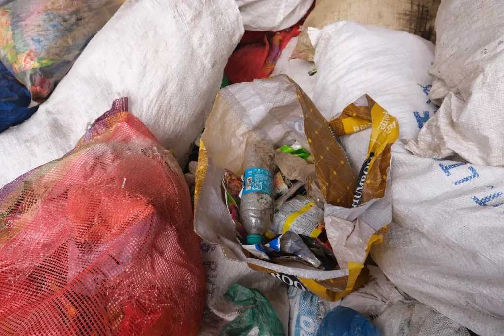 A PET bottle that needs to be manually crushed to lessen transportation load