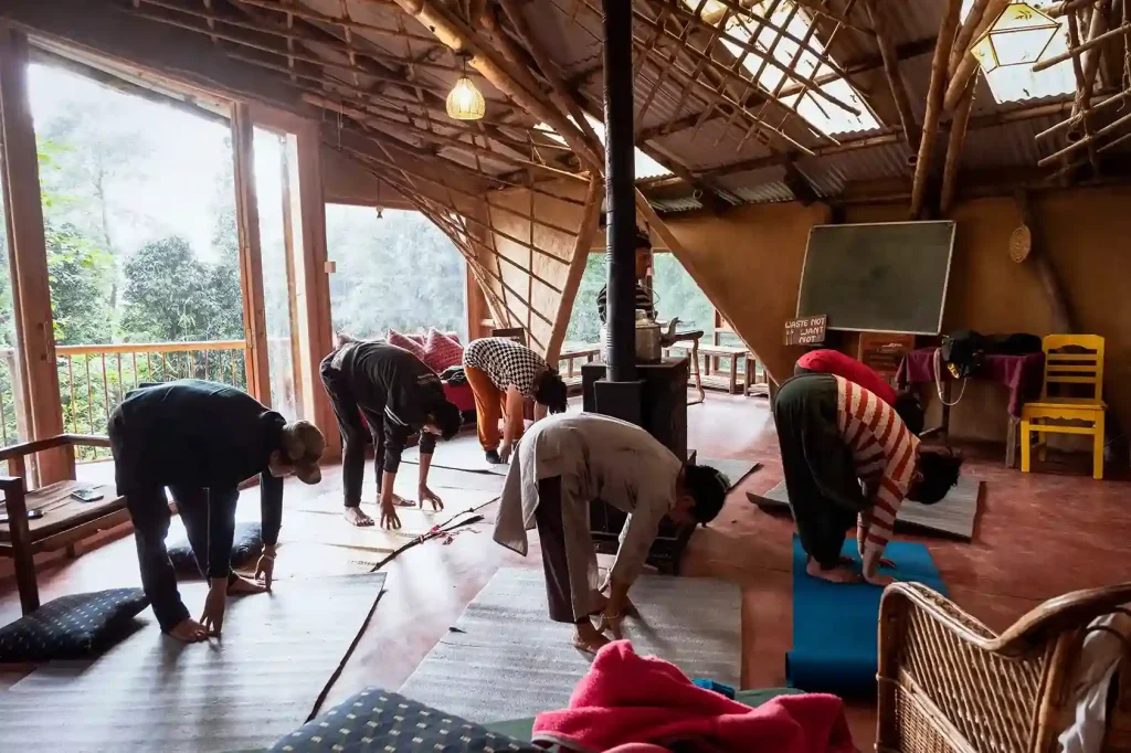 Restorative Supta Matsyendrasana – our team unwinding in a calming supine spinal twist for deep relaxation and release. TIEEDI, Darjeeling.